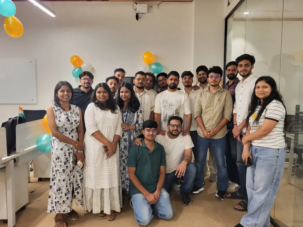 Supplymint team group photo at the office during the Independence Day celebration with tricolour balloons