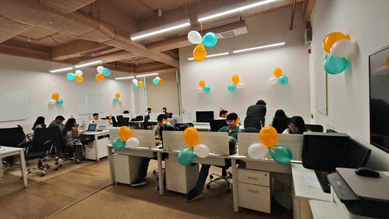 upplymint office decorated with tricolour balloons and Indian flags for Independence Day as the team works at their desks